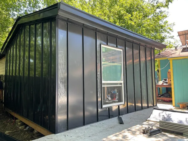 Black standing seam metal wall panels for Roof Inspection in Indian Hills