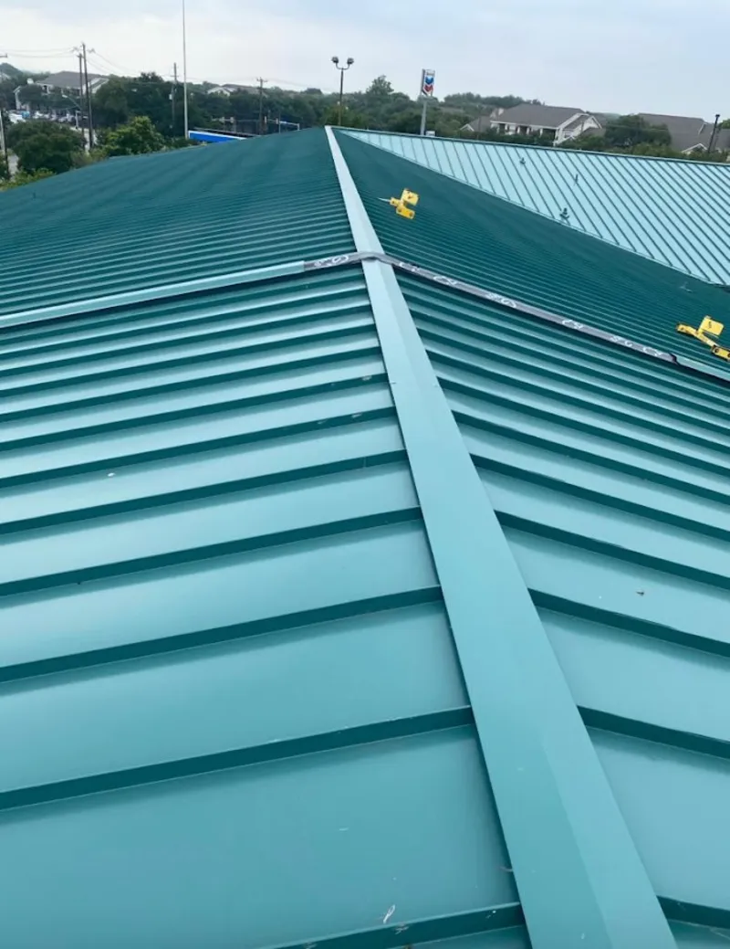Green commercial metal roof ridge and valley for Metal Roof Repair in Indian Hills